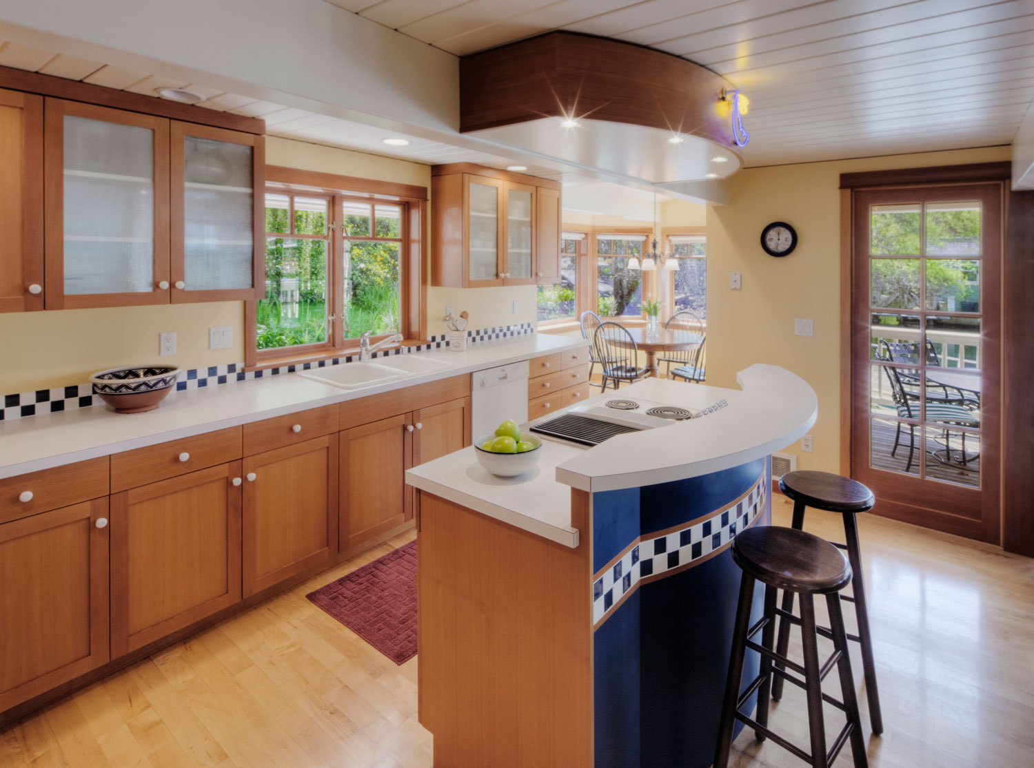Clean kitchen with light hardwood floors after renovation cleanup